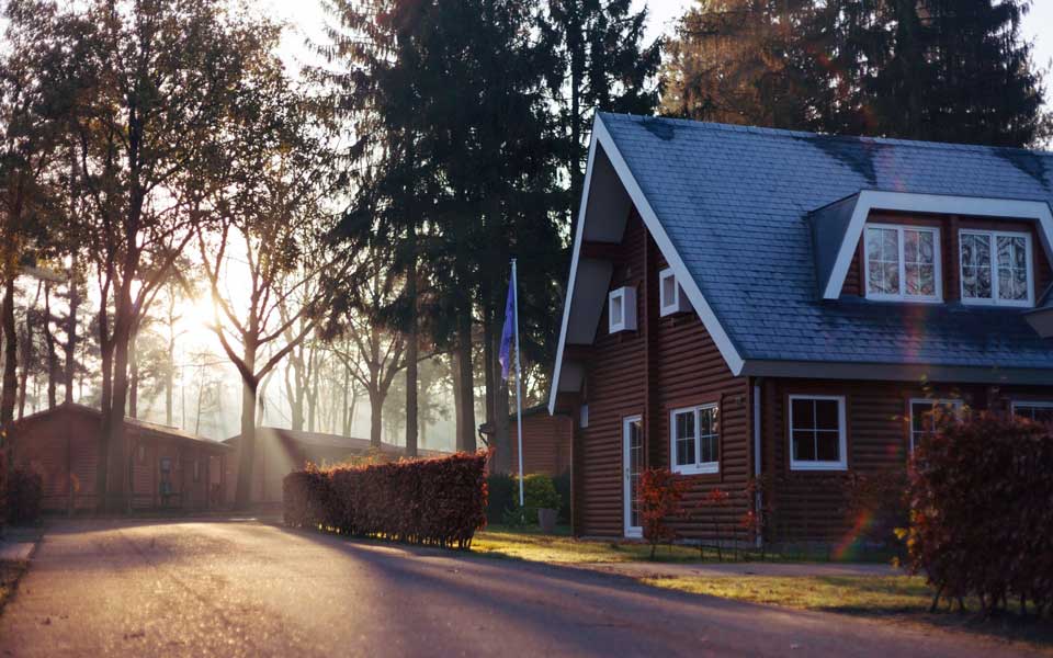 brown house with sunrays